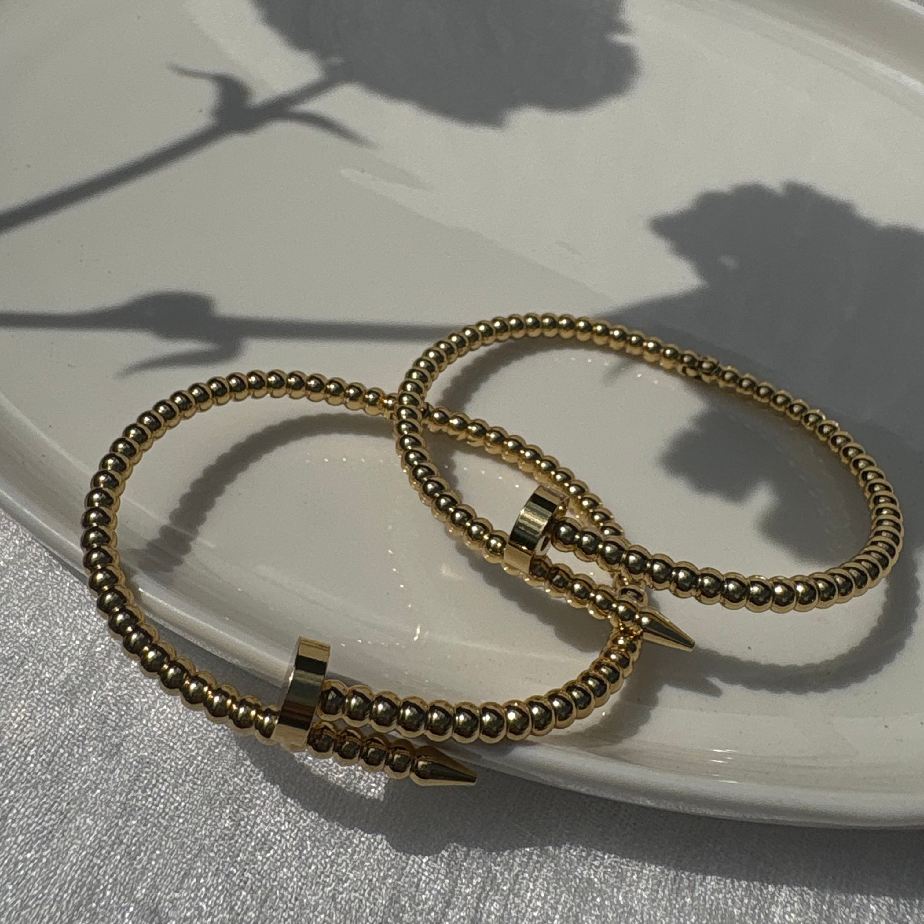 Beaded nail bracelet
